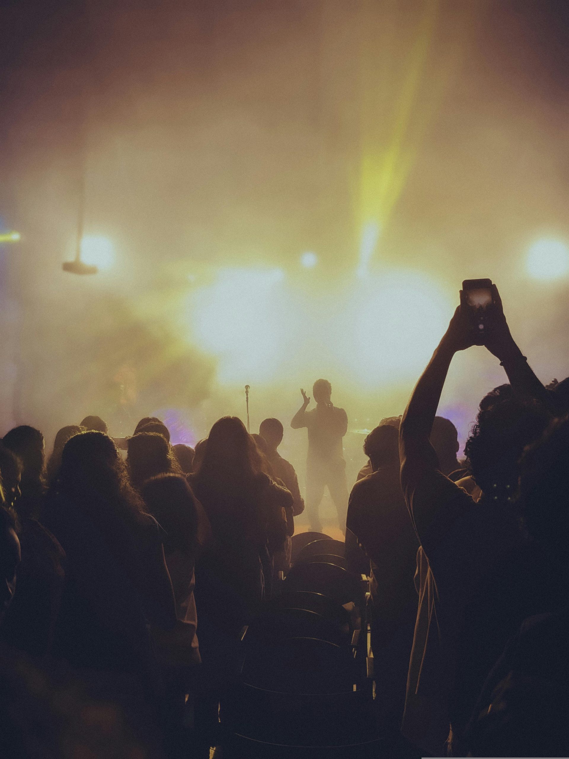 Person taking a photo at a concert